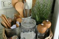08 use a low basket as a cool rustic caddy for storing utensils, spices and a little plant