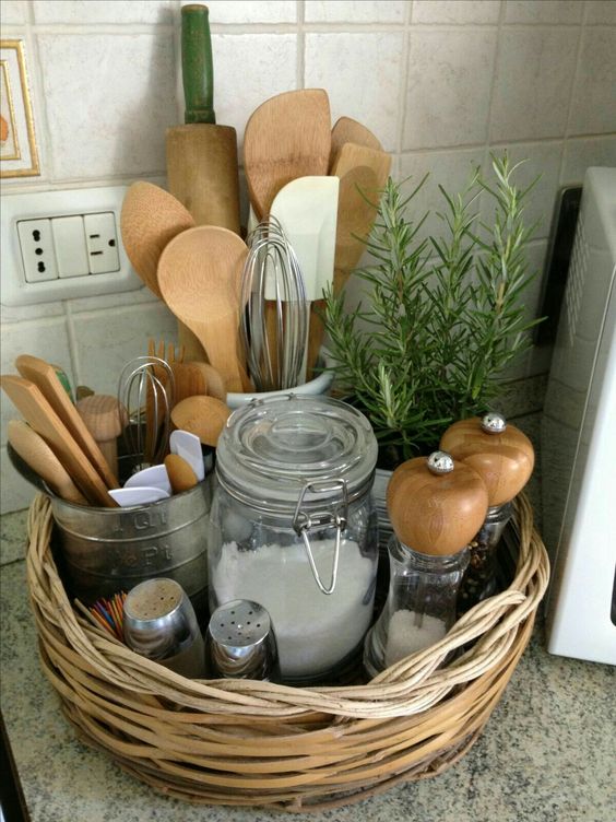 use a low basket as a cool rustic caddy for storing utensils, spices and a little plant