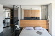 09 The bedroom is separated from the rest of the spaces with glass partitions