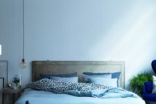 09 a light blue wall and matching bedding easily create a comforting ambience