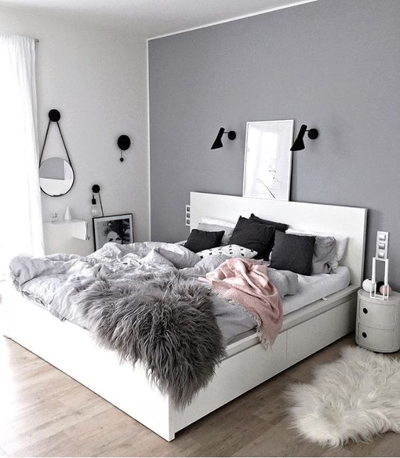 add some texture with a faux fur throw and and touches of different colors - pink and black