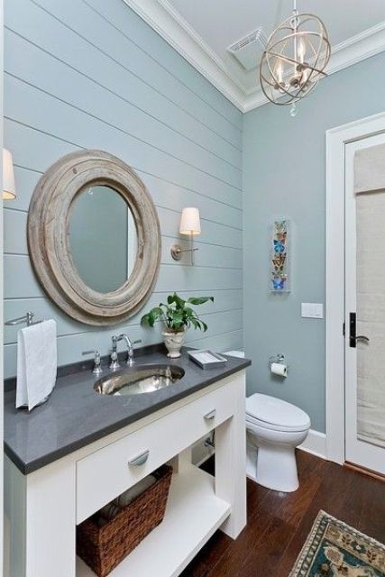 pale blue beadboard clad wall and matching painted walls for a rustic bathroom