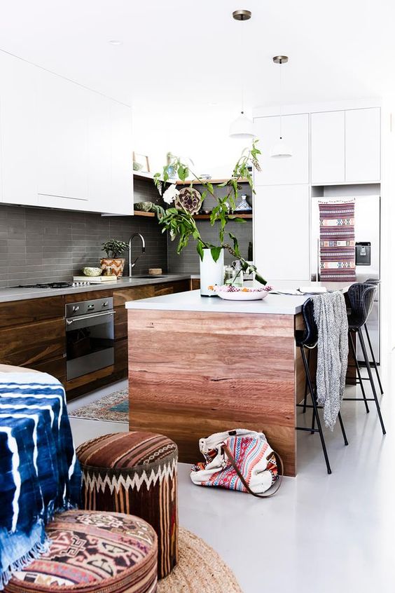 potted greenery, wood and colorful boho textiles and upholstery create a boho feel