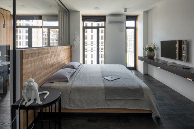 It features only a large bed and a floating vanity plus windows to fill it with light