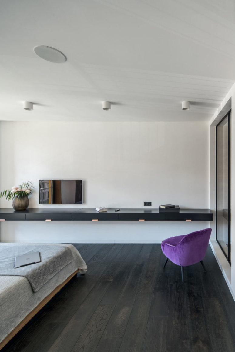 A bright purple chair is a great colorful touch to enliven the space