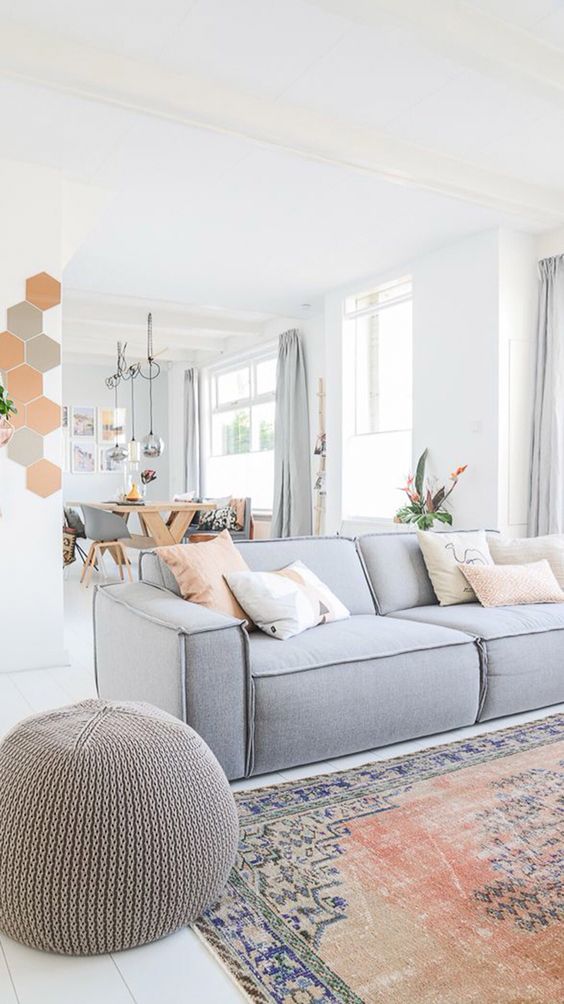 grey and coral as the main color accents in this neutral space are a cool and fresh idea