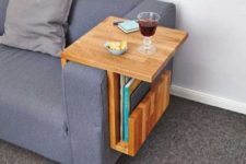 13 a stylish plywood sofa caddy with geometric lines features a top for drinks and gadgets and a pocket for books and magazines