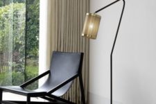 14 a stylish and refined floor lamp with a metal base and metal net lampshade adds style to the space