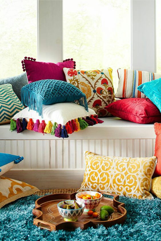 some bold pillows and a bright faux fur throw can completely change a neutral space
