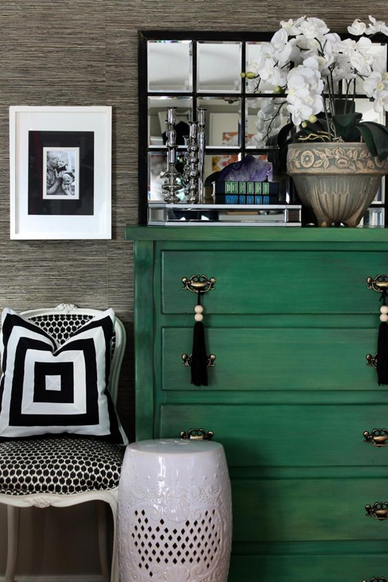 a bold green dresser with metal and tassel handles for a boho feel