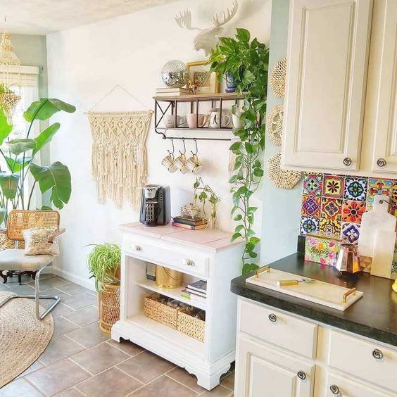 a boho chic kitchen spruced up with macrame, jute, wicker and a colorful tile backsplash