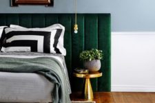 16 an upholstered emerald bed and a large headboard to add contrast and color to the space
