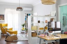 16 bright yellow touches in both spaces unite the open layout, which is still separated with a shelving unit