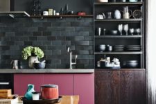 17 a moody kitchen in dark shades is spruced up with a bold pink cabinet and a bold stained table