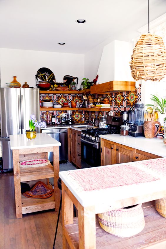 a colorful mosaic tile backsplash, a wicker lampshade and wooden cabinets for a boho feel