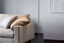 19 an elegant minimalist floor lamp with a thin metal leg, a metal base and a wooden linear lampshade