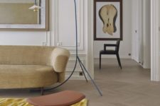 20 a bold floor lamp in blue with a tiny lampshade and a curved leg will add coclor and interest
