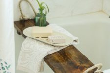 20 a rustic bathroom caddy of a stained wood piece and thick rope – such an item can be easily DIYed