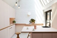 20 blush cabinets in a white attic kitchen create a subtle and tender look