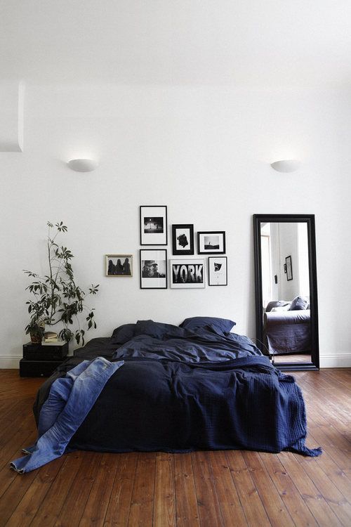 a gorgeous navy bedding set is a great and easy idea to add a masculine feel to the space