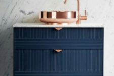 21 a navy geometric vanity with copper touches is a bold idea for a modern or art deco bathroom