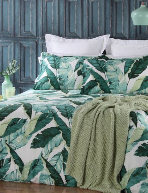 a bedding set in the shades of green and with a palm leaf print for a bright touch