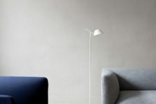 23 a minimalist white floor lamp with a small lampshade is great for reading
