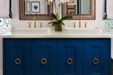 24 a chic navy bathroom vanity with ring pulls in brass adds an elegant feel to the bathroom