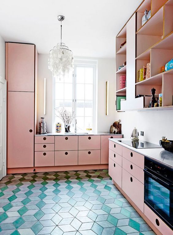 a bright pink kitchen with MDF cabinetry, a white countertop and a backsplash, upper open storage cabinets
