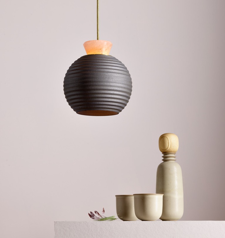 The Archaic Modern Light collection features three lights made of ceramic, brass and Himalayan pink salt