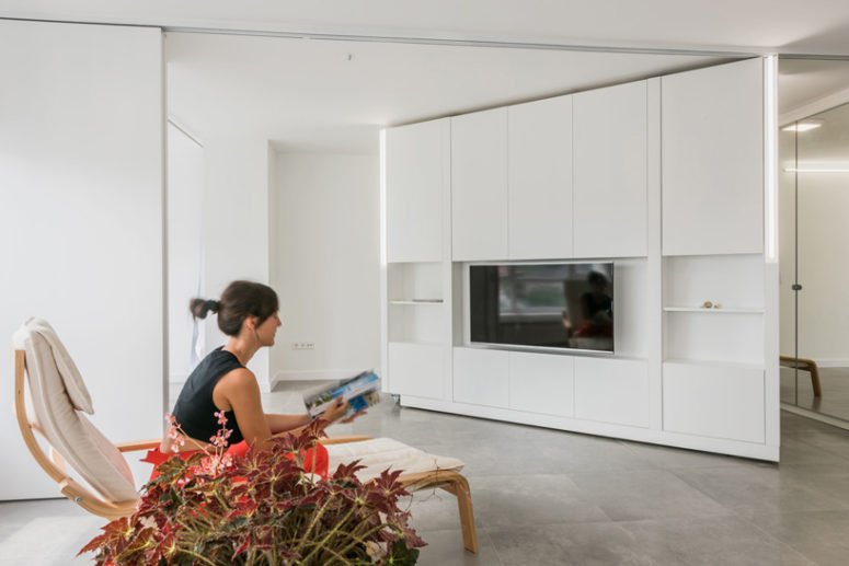 This apartment shows off a new feature, which is a solution to the problem of lack of space it's a rotating wall This apartment shows off a new feature, which is a solution to the problem of lack of space it's a rotating wall