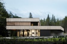 01 This minimalist home with bold architecture and natural materials used was built for a couple on a lake