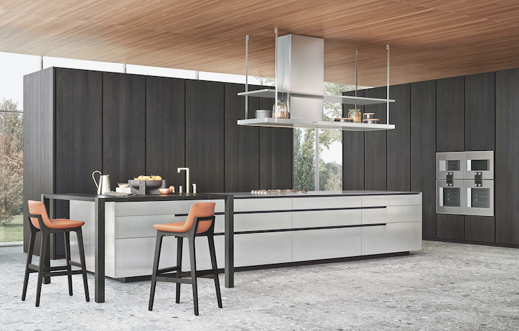 The kitchen is done in dark and light grey, there is solid wood and stainless steel that create a contrast and a modern feel The kitchen is done in dark and light grey, there is solid wood and stainless steel that create a contrast and a modern feel