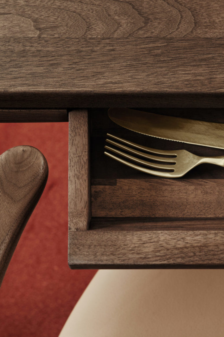 There's a small drawer concealed in the table, it may be used for storing cutlery