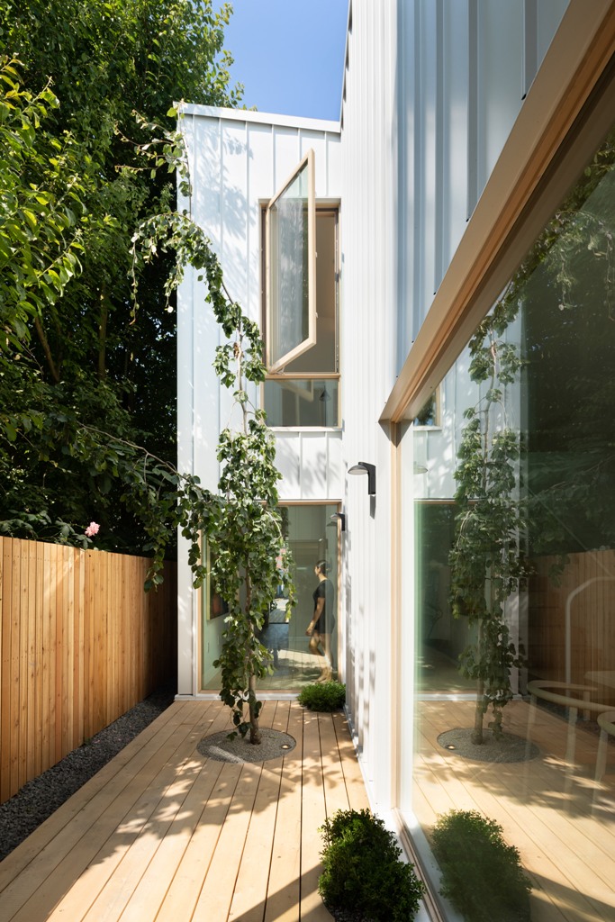 interesting outdoor area design with a living room There's a terrace with an outdoor living room and a deck with potted plants and greenery