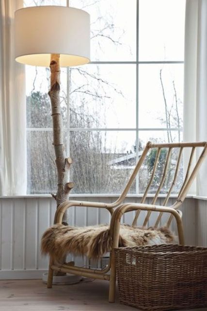 a chic lamp of a large birch branch, a base and a fabric lampshade is a perfect fit for Scandinavian spaces