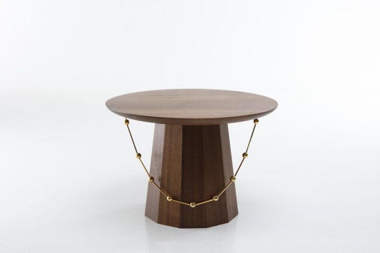 The tables are available in different finishes and materials, here it's walnut with faceted sides
