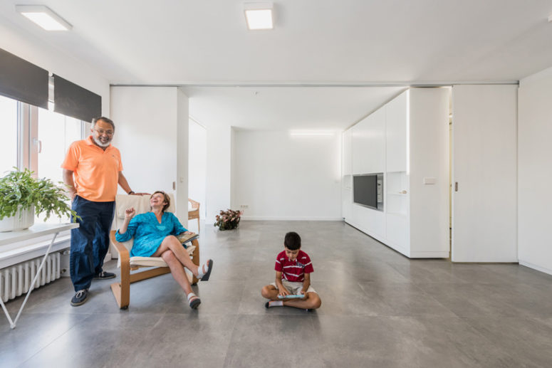 transformable open layout space Thanks to the rotating wall, the owners may create a large open layout or divide the spaces as they want