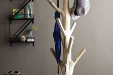 04 a coat rack made of a base and an old tree, which was cut and repurposed in the interior, a great idea for nature fans