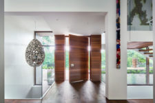 05 The entryway immediately strikes with a unique egg-shaped pendant lamp