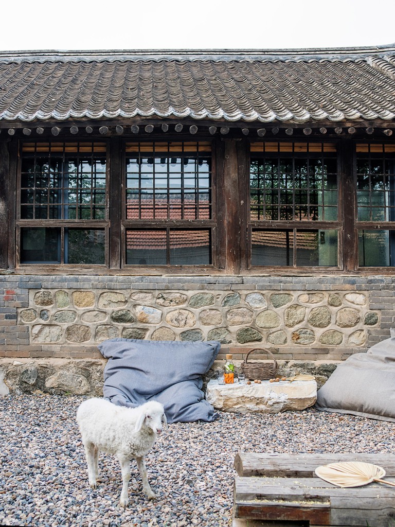 pebbles used for garden paths The pebbles that cover some paths allow sitting right on them, there are large pillows and cushions and a stone table