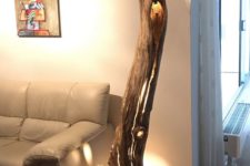 07 a large floor lamp made of a weathered and old hollow oak trunk for a natural feel