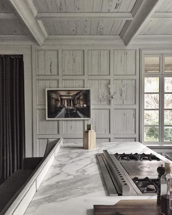 whitewashed pecky cypress paneling is a chic idea to add a vintage feel to this kitchen