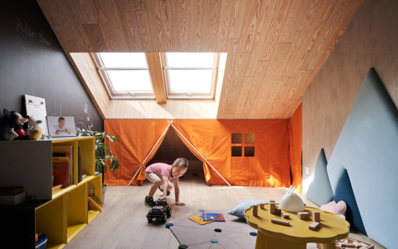 quite unique kids room design The kid's room features small windows, a plywood covered attic, a chalkboard wall and colorful furniture