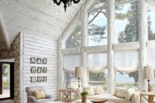08 a rustic space with an attic roof is highlighted with whitewashed wood walls and ceiling plus frames of the windows