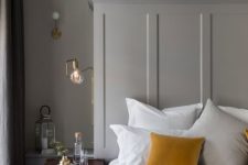 08 make your grey bedroom more interesting with mustard pillows and blankets and a mahogany nightstand