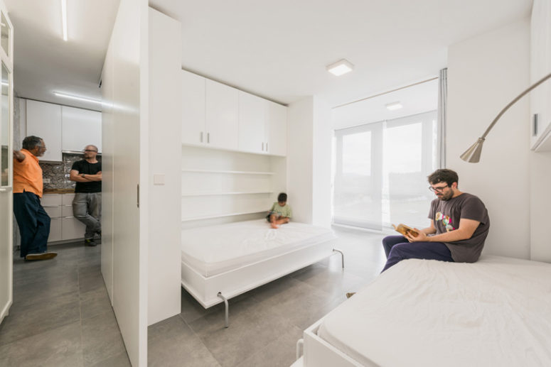 space saving beds for a small bedroom The bedroom area features two fold-down wall beds which frame the large windows