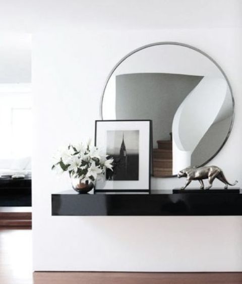 a black lacquered floating vanity is a chic and refined idea for a contemporary space