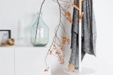 10 a stylish and simple combo of a coat rack and a little entryway table or seat – as you wish