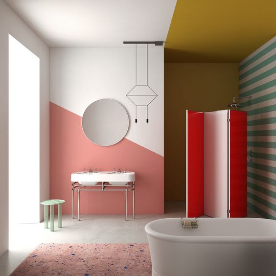a bright bathroom with coral, red, mustard and green touches, prints and color blocking at the same time